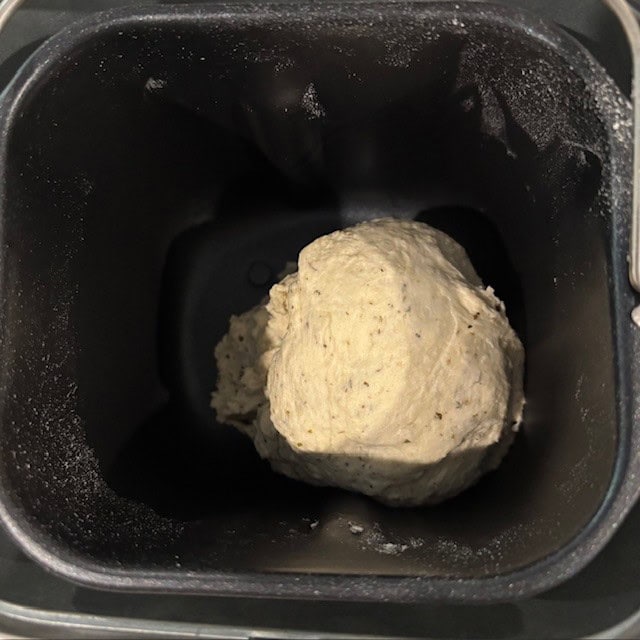 Dough for 1 lb bread machine Italian herb bread in a bread pan.