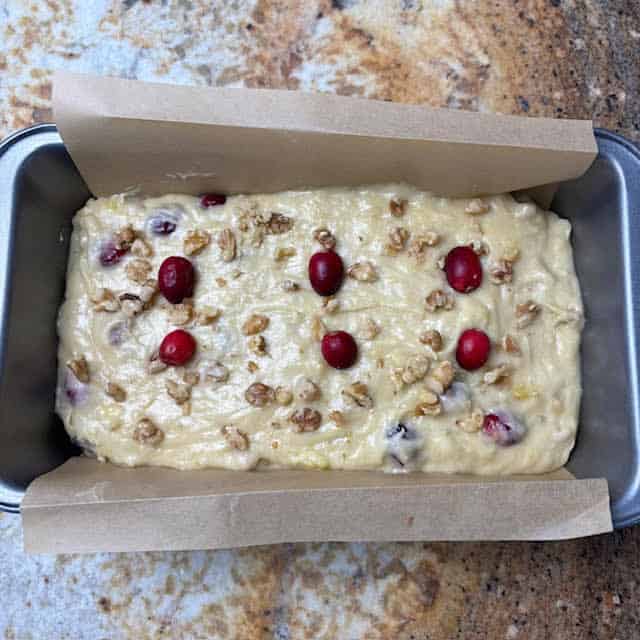Cranberry banana nut bread batter in pan before baking.