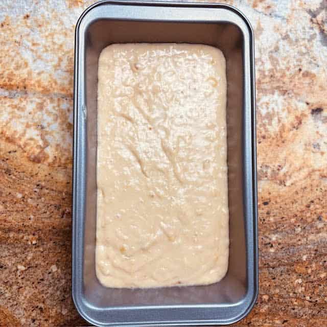 Batter for super moist banana bread in a bread pan.