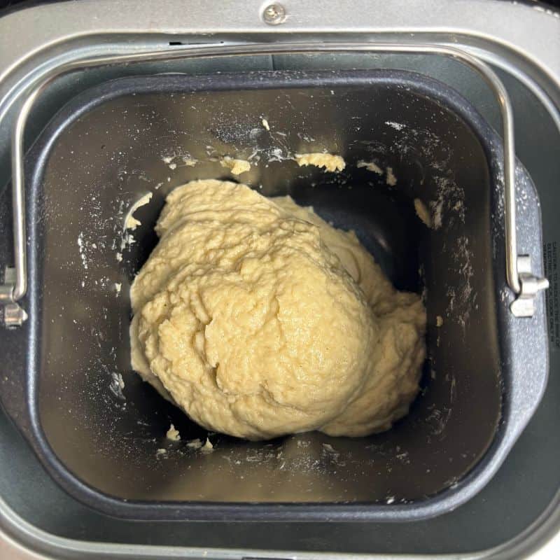 Dough for my bread machine gluten free bread recipe being made in a small bread machine.