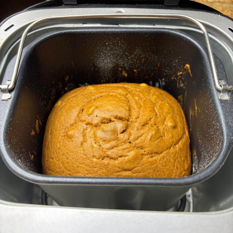 Bread machine pumpkin bread in bread machine pan.
