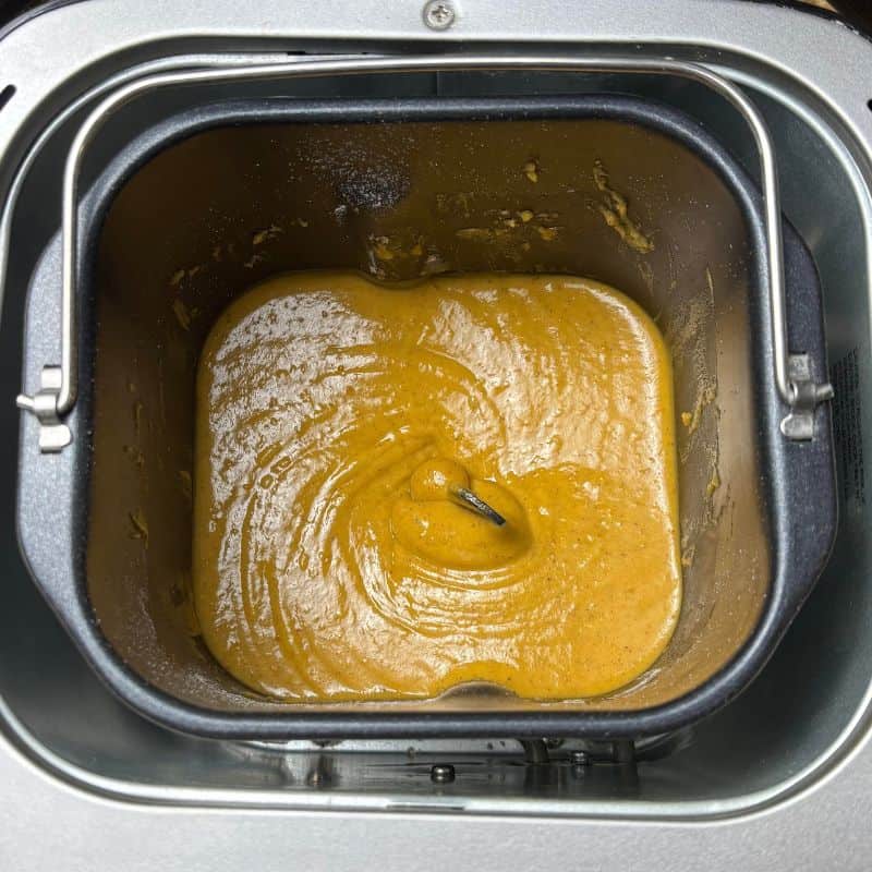 Batter for bread machine pumpkin bread in a bread machine pan.